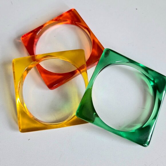 3 Lucite bangles Jewelry - Set of 3 Lucite orange yellow green square bangles.